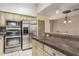 Bright kitchen featuring stainless steel appliances, sleek countertops, and easy access to dining area at 1953 E Presidio Rd, Phoenix, AZ 85022