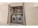 Modern laundry room closet with front loading washer and dryer at 1953 E Presidio Rd, Phoenix, AZ 85022
