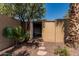 Backyard shed with desert landscaping and shade from mature trees at 1953 E Presidio Rd, Phoenix, AZ 85022
