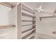 Spacious walk-in closet with shelving and hanging rods provides ample storage space at 1953 E Presidio Rd, Phoenix, AZ 85022
