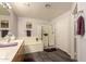 Bright bathroom featuring double sinks, a soaking tub, a glass-enclosed shower, and tile floors at 19700 N 76Th St # 1040, Scottsdale, AZ 85255