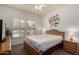 Bright bedroom features shuttered windows, ceiling fan, and tasteful wall art at 19700 N 76Th St # 1040, Scottsdale, AZ 85255