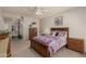 Comfortable bedroom featuring carpeted floors, a ceiling fan, and ample natural light at 19700 N 76Th St # 1040, Scottsdale, AZ 85255