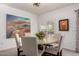 Charming dining area with a round table, stylish chairs, and a serene ambiance at 19700 N 76Th St # 1040, Scottsdale, AZ 85255