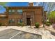 Charming two-story home with stucco exterior and stone accents, situated in a beautifully landscaped yard at 19700 N 76Th St # 1040, Scottsdale, AZ 85255