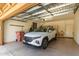 Clean and spacious garage with ample storage and a modern SUV parked inside at 19700 N 76Th St # 1040, Scottsdale, AZ 85255