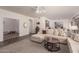 Open-concept living space featuring plush seating, stylish decor, and seamless flow to dining area at 19700 N 76Th St # 1040, Scottsdale, AZ 85255