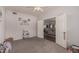 Versatile office space with neutral colors, carpet, and easy access to the living room at 19700 N 76Th St # 1040, Scottsdale, AZ 85255