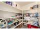 Spacious walk-in pantry with ample shelving for organized storage at 19700 N 76Th St # 1040, Scottsdale, AZ 85255