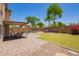 Inviting backyard featuring a covered patio, lush lawn, and a secure fenced pool area for Gathering fun at 1991 S Bahama Dr, Gilbert, AZ 85295