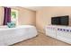 Bright bedroom featuring a large window and simple decor, creating a serene and inviting space at 1991 S Bahama Dr, Gilbert, AZ 85295