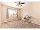 Bedroom featuring a ceiling fan and a bright window, creating a comfortable and inviting space at 1991 S Bahama Dr, Gilbert, AZ 85295