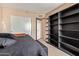 Serene bedroom with shelving and modern decor, creating a cozy and inviting atmosphere at 1991 S Bahama Dr, Gilbert, AZ 85295