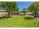 Lush green park with mature trees, walking path, and community playground offers residents a scenic outdoor retreat at 1991 S Bahama Dr, Gilbert, AZ 85295