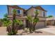 Charming two-story home features a two-car garage, well-maintained desert landscaping and shutters at 1991 S Bahama Dr, Gilbert, AZ 85295