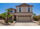 Charming two-story home with a well-maintained yard, two-car garage and mature palm tree at 1991 S Bahama Dr, Gilbert, AZ 85295
