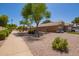 Attractive single-story home features desert landscaping, mature trees, and a convenient side entry garage at 1991 S Bahama Dr, Gilbert, AZ 85295