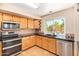 A spacious kitchen with stainless steel appliances and tile countertops at 1991 S Bahama Dr, Gilbert, AZ 85295
