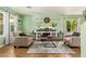 Bright living room featuring stylish furniture, decor, and an electric fireplace at 1991 S Bahama Dr, Gilbert, AZ 85295