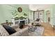 Bright living room featuring stylish furniture, decor, and an electric fireplace at 1991 S Bahama Dr, Gilbert, AZ 85295