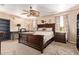 Main bedroom features a ceiling fan, a desk, and carpet at 1991 S Bahama Dr, Gilbert, AZ 85295