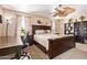 Bedroom with ceiling fan, desk area, carpet, and natural light at 1991 S Bahama Dr, Gilbert, AZ 85295