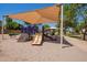 Inviting playground features a covered area, slides, and climbing structures for endless outdoor fun at 1991 S Bahama Dr, Gilbert, AZ 85295