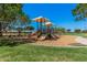 A playground offers fun for children with multiple slides and shaded canopy structures at 1991 S Bahama Dr, Gilbert, AZ 85295
