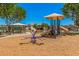 Gathering-friendly playground with modern equipment and a shaded canopy for year-round enjoyment at 1991 S Bahama Dr, Gilbert, AZ 85295