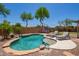 Inviting backyard pool features beautiful landscaping and lounge chairs for relaxing by the water at 1991 S Bahama Dr, Gilbert, AZ 85295