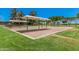 Community swing set area with multiple swings for all ages to enjoy, also sand volleyball nearby at 1991 S Bahama Dr, Gilbert, AZ 85295