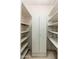 Spacious walk-in pantry with ample shelving and storage cabinet space for organizing kitchen essentials at 2002 W Whitton Ave, Phoenix, AZ 85015