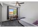 Bedroom featuring carpet, a ceiling fan, natural light, a desk and a single bed at 21813 N 40Th Way, Phoenix, AZ 85050