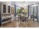 Charming dining area with natural light, cozy seating, and a view of the backyard, creating a warm atmosphere at 21813 N 40Th Way, Phoenix, AZ 85050