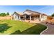 Spacious backyard featuring covered patio with bar and plenty of green space at 2230 E Whitten St, Chandler, AZ 85225