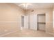 Cozy bedroom with carpet flooring, ceiling fan, and closet with sliding doors at 2230 E Whitten St, Chandler, AZ 85225
