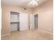Bedroom showcasing carpet flooring, a ceiling fan, and a closet with sliding doors at 2230 E Whitten St, Chandler, AZ 85225
