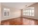 Bright bedroom with hardwood floors and plantation shutters on windows at 2230 E Whitten St, Chandler, AZ 85225