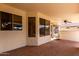 Spacious covered patio with stone floor, ceiling fan and wet bar; perfect for outdoor entertaining at 2230 E Whitten St, Chandler, AZ 85225