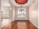 Dining room featuring hardwood floors, decorative chandelier, and large windows at 2230 E Whitten St, Chandler, AZ 85225