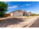 A single-story home with a three-car garage and desert landscaping for low maintenance at 2230 E Whitten St, Chandler, AZ 85225