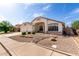 Inviting single-story home featuring desert landscaping and a spacious three-car garage at 2230 E Whitten St, Chandler, AZ 85225