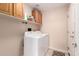 Convenient laundry area with storage cabinets above the side-by-side washer and dryer at 2230 E Whitten St, Chandler, AZ 85225