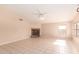 Open living room with tile floors, fireplace, and ample natural light at 2230 E Whitten St, Chandler, AZ 85225