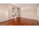 Open-concept living room featuring hardwood floors and archways to other rooms at 2230 E Whitten St, Chandler, AZ 85225
