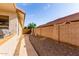 Side yard with walkway; offering a tidy and low-maintenance space at 2230 E Whitten St, Chandler, AZ 85225