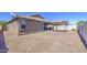 This home features a gravel backyard and shade structure at 23781 W Mohave St, Buckeye, AZ 85326