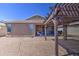 Private backyard with gravel, a covered patio, and shade structure at 23781 W Mohave St, Buckeye, AZ 85326