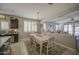 Open-concept dining area with large windows and views into the main living space at 23781 W Mohave St, Buckeye, AZ 85326