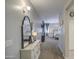 View down hallway leading to the main bedroom with soft carpet at 23781 W Mohave St, Buckeye, AZ 85326